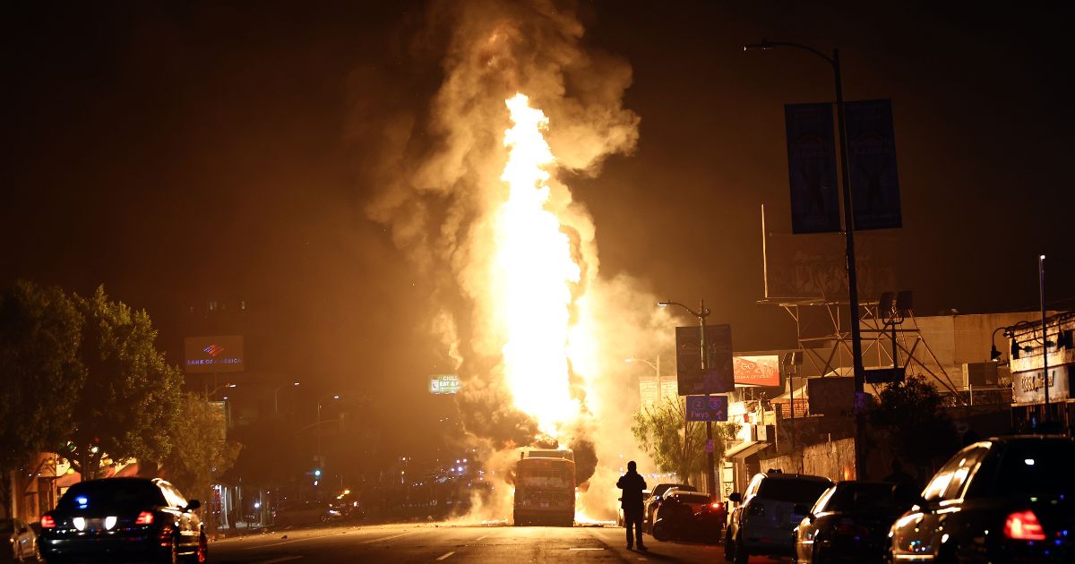 A Metro bus bus burns following Dodger fan celebrations in the area in Echo Park after the Los Angeles Dodgers defeated the New York Yankees in Game 5 to win the World Series on October 31, 2024 in Los Angeles, California.