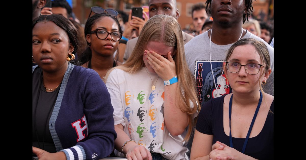 Supporters react as Democratic presidential nominee, U.S. Vice President Kamala Harris concedes the election during a speech at Howard University on November 6, 2024 in Washington, DC.