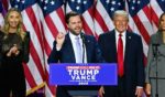 US Senator from Ohio and Republican vice presidential candidate J.D. Vance (C) speaks alongside former US President and Republican presidential candidate Donald Trump during an election night event at the West Palm Beach Convention Center in West Palm Beach, Florida, on November 6, 2024.