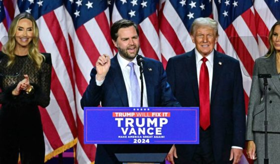 US Senator from Ohio and Republican vice presidential candidate J.D. Vance (C) speaks alongside former US President and Republican presidential candidate Donald Trump during an election night event at the West Palm Beach Convention Center in West Palm Beach, Florida, on November 6, 2024.