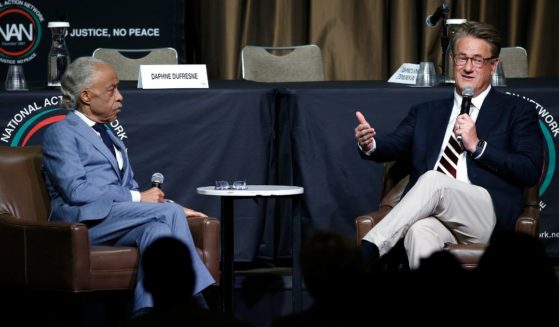 Rev. Al Sharpton and Joe Scarborough speak during the National Action Network's Women's Empowerment Luncheon at the Sheraton New York on April 11, 2024 in New York City.