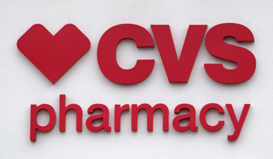 The CVS Pharmacy logo is displayed on a store in Woburn, Massachusetts,on Aug. 3, 2021.