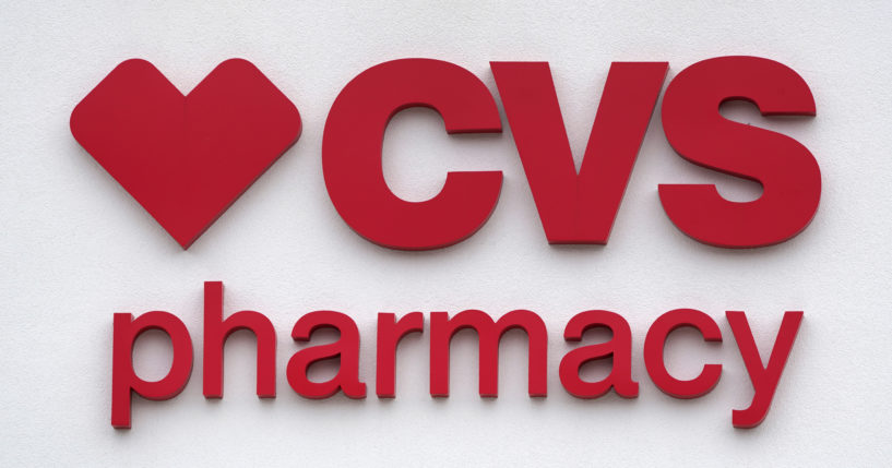 The CVS Pharmacy logo is displayed on a store in Woburn, Massachusetts,on Aug. 3, 2021.