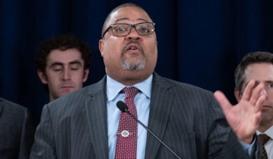 Manhattan District Attorney Alvin Bragg stands with members of his staff at a news conference following the conviction of former President Donald Trump in his hush money trial in New York City on May 30.