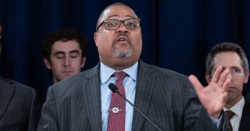 Manhattan District Attorney Alvin Bragg stands with members of his staff at a news conference following the conviction of former President Donald Trump in his hush money trial in New York City on May 30.