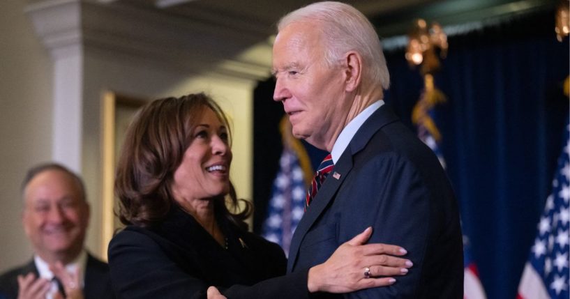 President Joe Biden, right, embraces Vice President Kamala Harris during the Democratic National Committee's Holiday Reception in Washington, D.C., on Dec. 15.