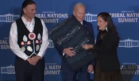 At a Tribal Nations Summit on Monday, President Joe Biden, center, had difficulty finding the cameras during a photo op.