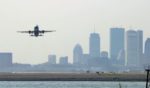 An airplane departs Logan International Airport in Boston, Massachusetts.