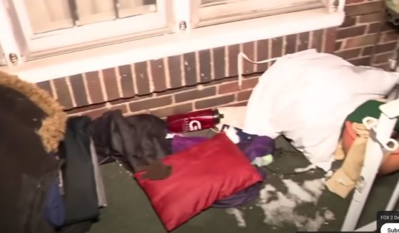 This image shows the porch that two boys, aged 12 and 15, have been sleeping on since July in Detroit.