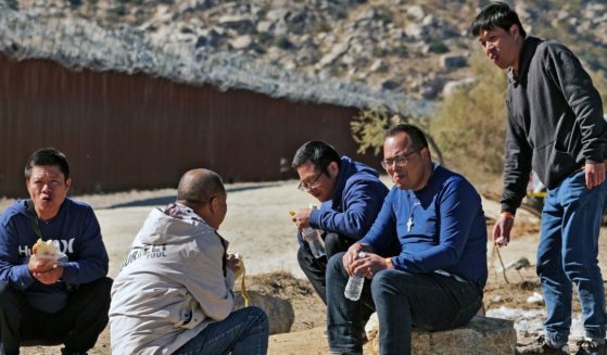 Chinese illegal immigrants attempting to cross into the U.S. from Mexico are detained by U.S. Customs and Border Protection at the border in Jacumba, California, on Nov. 11, 2023.