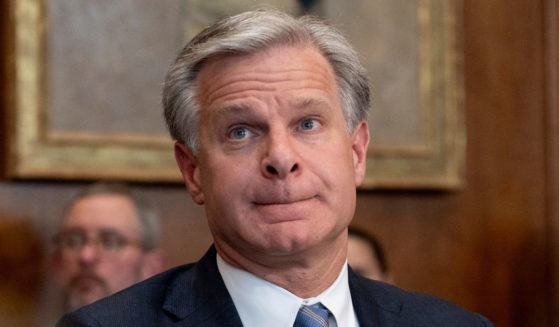 FBI Director Christopher Wray listens at the beginning of a meeting of the Justice Department's Election Threats Task Force at the Justice Department in Washington, D.C., on Sept. 4.