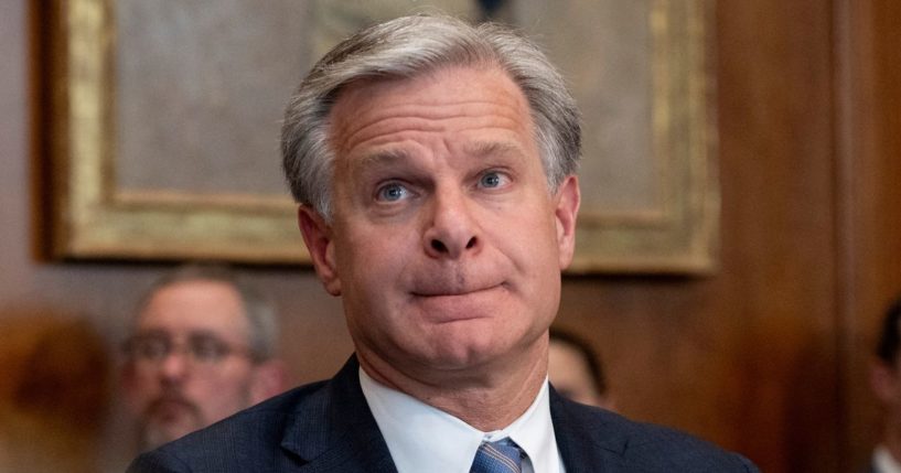 FBI Director Christopher Wray listens at the beginning of a meeting of the Justice Department's Election Threats Task Force at the Justice Department in Washington, D.C., on Sept. 4.