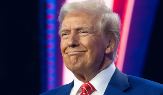 President-elect Donald Trump smiles during Turning Point USA's AmericaFest in Phoenix, Arizona, on Sunday.