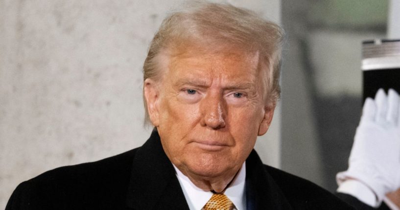 President-elect Donald Trump poses for a photo after a meeting at The Elysee Presidential Palace in Paris, France, on Saturday.