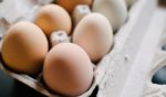 This stock image shows eggs packaged in a container.