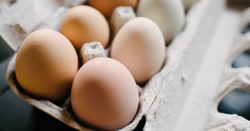 This stock image shows eggs packaged in a container.