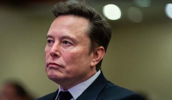 Elon Musk, seen in a November photo, is doing battle with the SEC over his purchase of social media platform Twitter, which he later renamed X.