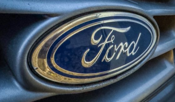 The logo of the Ford Motor Company is displayed on the front grille of a old Ford van in Wells, England, on Nov. 28.