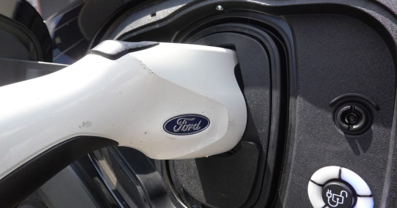 An electric vehicle is charged at the Golf Mill Ford dealership in Niles, Illinois, on July 18, 2023.