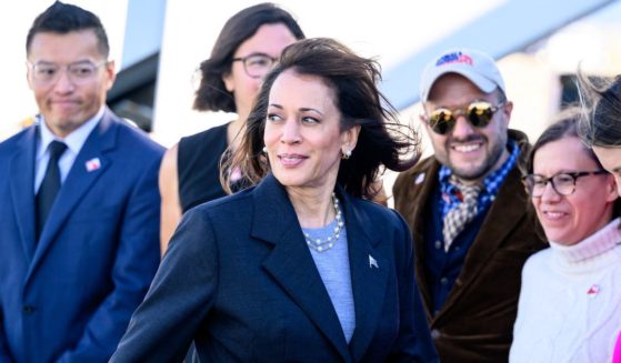 Vice President Kamala Harris prepares to pose for a photo with local campaign staff members in San Francisco, California, on Sept. 28.