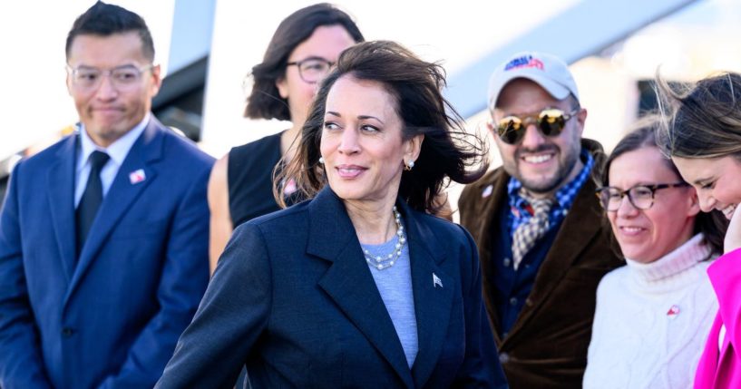 Vice President Kamala Harris prepares to pose for a photo with local campaign staff members in San Francisco, California, on Sept. 28.