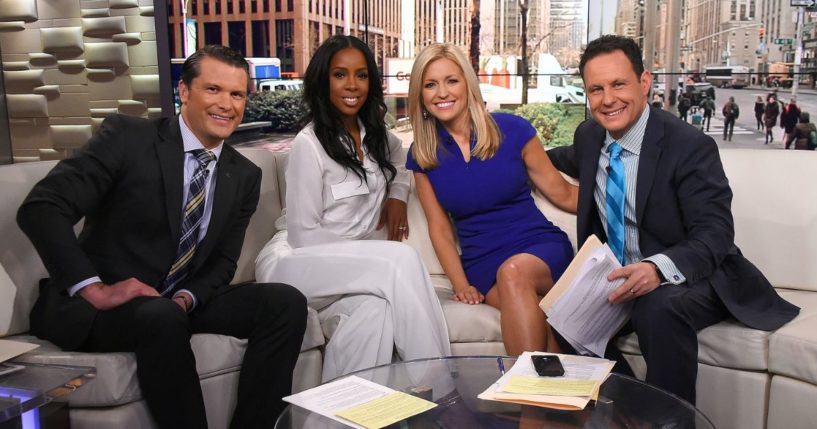 Then-"Fox and Friends" co-host Pete Hegseth, left, interviews Kelly Rowland, second from left, with Ainsley Earhardt, second from right, and Brian Kilmeade, right, in New York City on March 21, 2016.