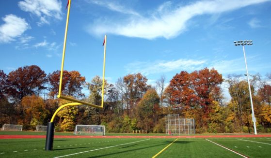 A high school football field in the autumn.