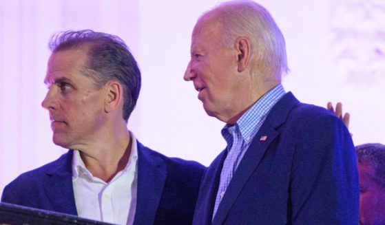 President Joe Biden, right, stands next to his son Hunter Biden, left, after watching the Independence Day fireworks display from the White House in Washington, D.C., on July 4.