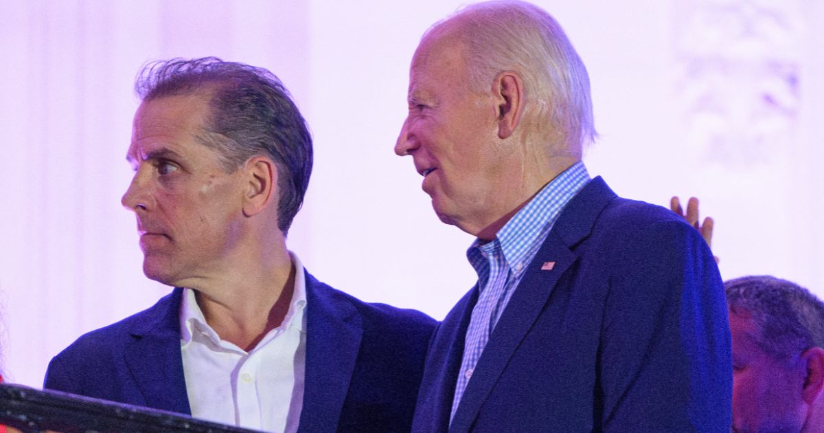 President Joe Biden, right, stands next to his son Hunter Biden, left, after watching the Independence Day fireworks display from the White House in Washington, D.C., on July 4.