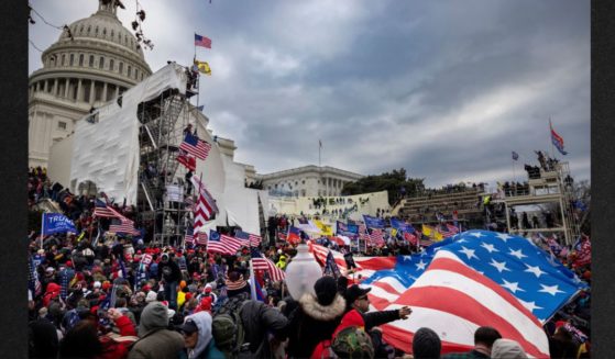 Protesters clash with police and security forces as people try to storm the U.S.Capitol on Jan. 6, 2021, in Washington, D.C. Demonstrators breached security and entered the Capitol as Congress debated the 2020 presidential election electoral vote certification. Now the FBI has admitted it had more than two dozen confidential human sources at the event.