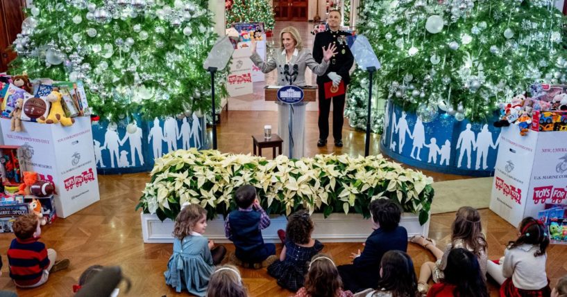 First lady Jill Biden, accompanied by Lt. Gen. Leonard Anderson IV, Commander of the U.S. Marine Corps Reserve, speaks during a Toys for Tots event in the East Room of the White House Friday