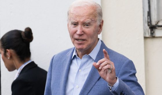 President Joe Biden answers a question from reporters as he exits Holy Cross Catholic Church after attending mass in Christiansted, St. Croix, U.S. Virgin Islands, on Saturday.