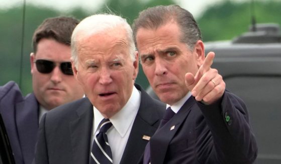 President Joe Biden, left, and son Hunter Biden, right, arrive at Delaware Air National Guard Base in New Castle, Delaware, on June 11.