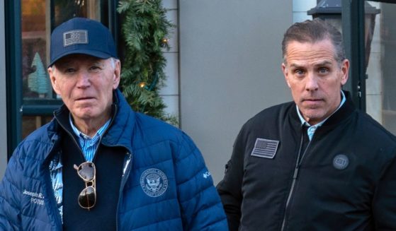 President Joe Biden, left, and his son, Hunter Biden, right, leave a book store as they walk in downtown Nantucket, Massachusetts, on Friday.