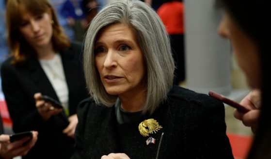 Sen. Joni Ernst speaks to reporters as she walks to a Senate luncheon at the U.S. Capitol in Washington, D.C., on Nov. 19.