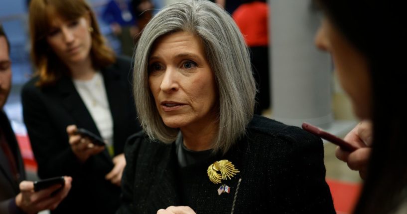 Sen. Joni Ernst speaks to reporters as she walks to a Senate luncheon at the U.S. Capitol in Washington, D.C., on Nov. 19.