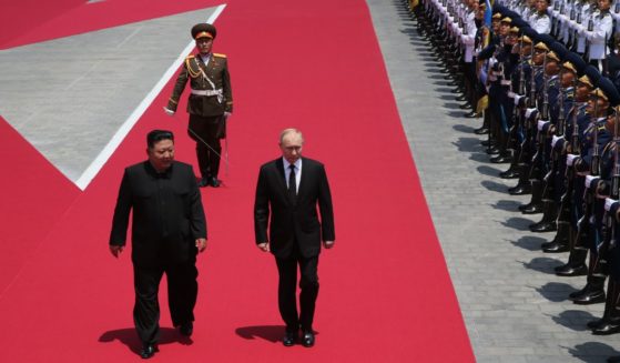 Russia's President Vladimir Putin (R) and North Korean Supreme Leader Kim Jong Un (L) attend a welcoming ceremony before Russian-North Korean talks, June 19, 2024 in Pyongyang, North Korea.