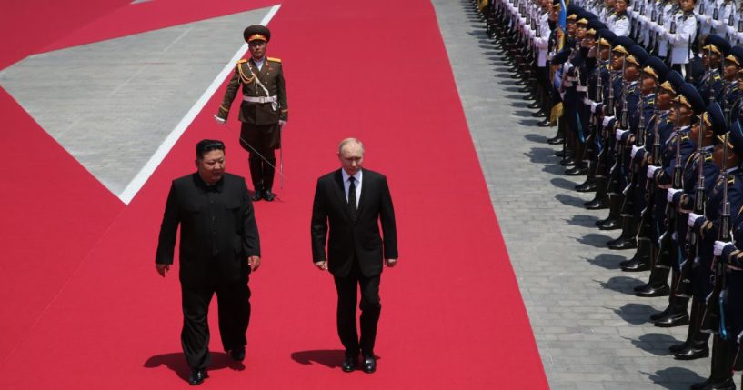 Russia's President Vladimir Putin (R) and North Korean Supreme Leader Kim Jong Un (L) attend a welcoming ceremony before Russian-North Korean talks, June 19, 2024 in Pyongyang, North Korea.