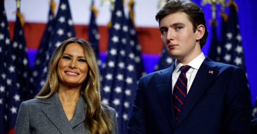 Former and future first lady Melania Trump, left, and Barron Trump, right, look on as President-elect Donald Trump speaks during an election night event in West Palm Beach, Florida, on Nov. 6.