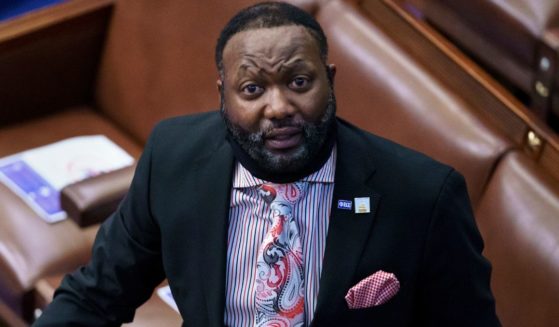 Capitol Police Lt. Michael Byrd helps to direct the evacuation of the House chamber in the Capitol in Washington, D.C., on Jan. 6, 2021.