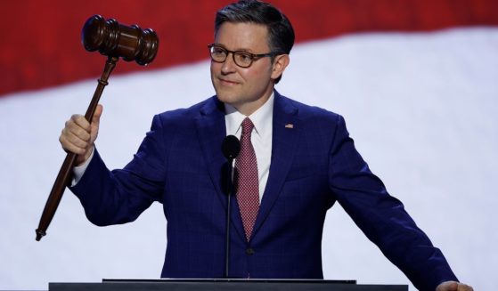 Speaker of the House Mike Johnson holds the gavel onstage ahead of the start of the first day of the Republican National Convention in Milwaukee, Wisconsin, on July 15.