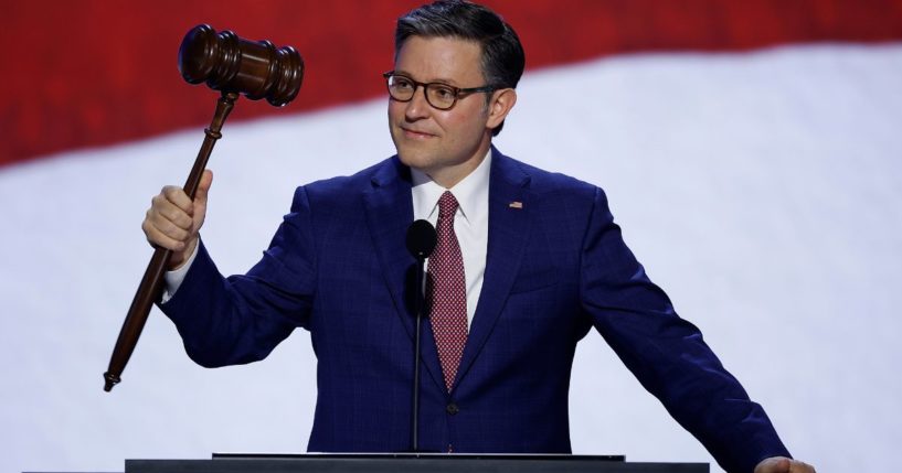 Speaker of the House Mike Johnson holds the gavel onstage ahead of the start of the first day of the Republican National Convention in Milwaukee, Wisconsin, on July 15.