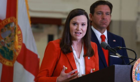 Florida Gov. Ron DeSantis, right, and Florida Attorney General Ashley Moody, seen at a September news conference, both criticized the federal government's actions in investigating a Sept. 17 assassination attempt against former President Donald Trump while he was golfing at Trump International Golf Club.