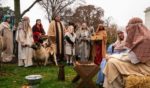 Participants dressed as townspeople take part in Faith & Liberty's annual live nativity scene outside the Supreme Court.