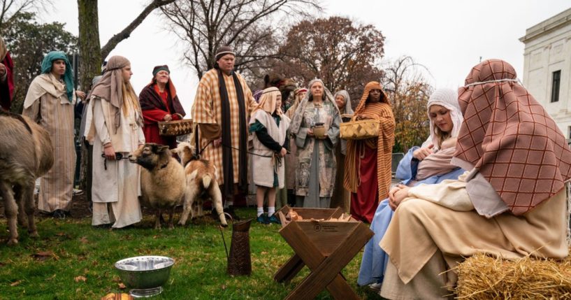 Participants dressed as townspeople take part in Faith & Liberty's annual live nativity scene outside the Supreme Court.