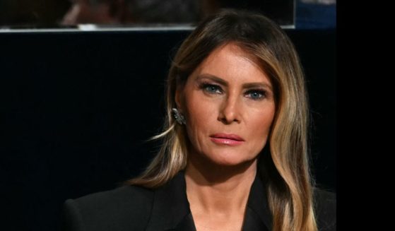 Former US President and Republican presidential candidate Donald Trump speaks with Archbishop of New York Timothy M. Dolan (L) as his wife Melania Trump looks on during the 79th Annual Alfred E. Smith Memorial Foundation Dinner at the Hilton Midtown in New York, October 17, 2024.