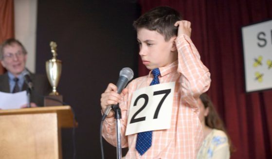 Stock image of a boy at a spelling bee.