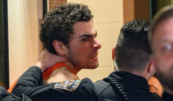 Suspected shooter Luigi Mangione is led into the Blair County Courthouse for an extradition hearing December 10, 2024 in Hollidaysburg, Pennsylvania.