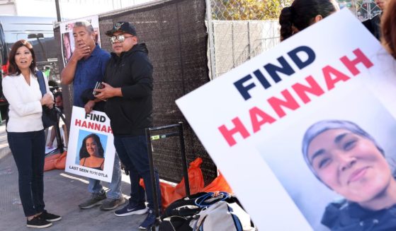 Los Angeles, California November 21, 2024-Volunteers put up flyers of missing Maui woman Hannah Kobayashi outside Crypto.com Arena in Downtown Los Angeles Thursday.