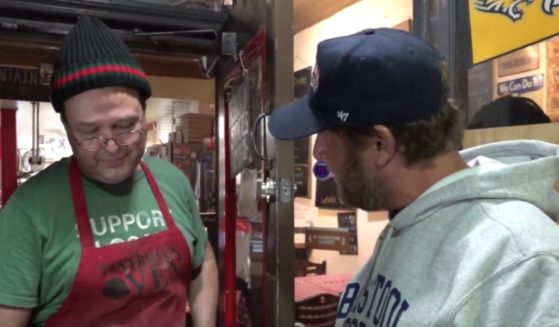 Barstool Sports founder Dave Portnoy, right, visited TinyBrickOven pizza shop in Baltimore, Maryland, and gave owner Will Fagg, left, $60,000 to keep the restaurant from closing.